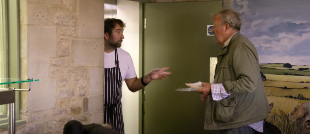Scene from Clarkson's Farm showing Jeremy Clarkson and a farmhand.