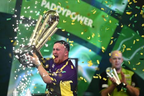 Luke Littler celebrates winning the PDC World Darts Championship.