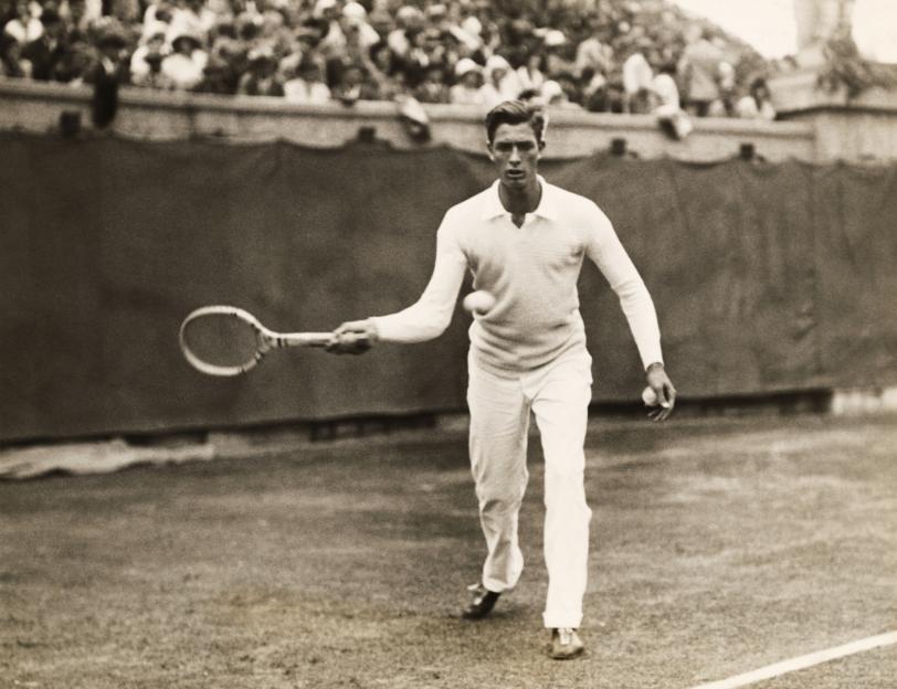 Black and white photo of Frank Shields playing tennis.