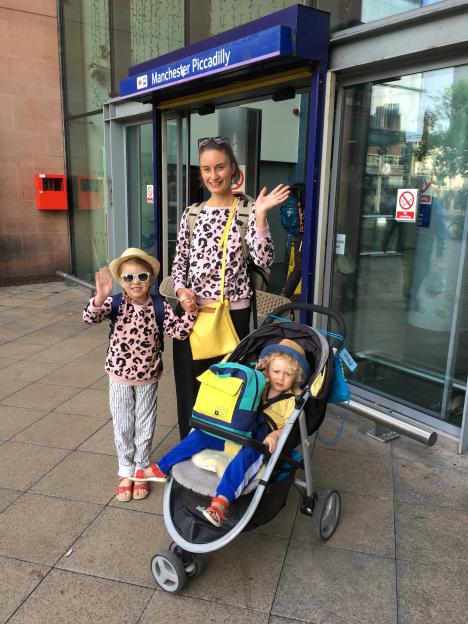Family at Manchester Piccadilly train station.