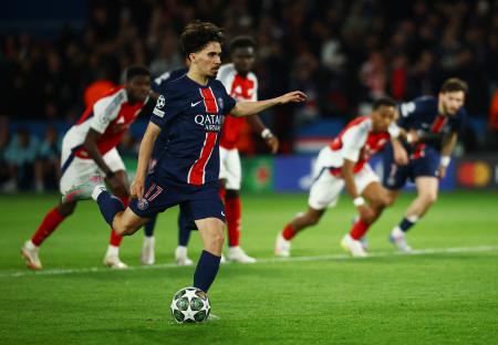 Paris St Germain's Vitinha taking a penalty kick.