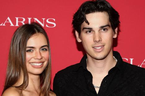 Nepo-baby with VERY famous Hollywood star dad poses with girlfriend at showbiz party – can you guess who he is?