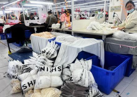 Factory workers at a Shein warehouse.