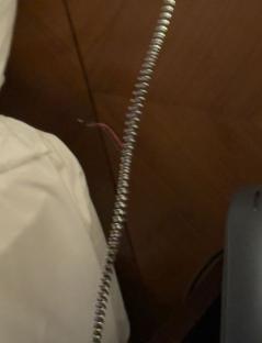 Faulty hotel bed lamp cord.