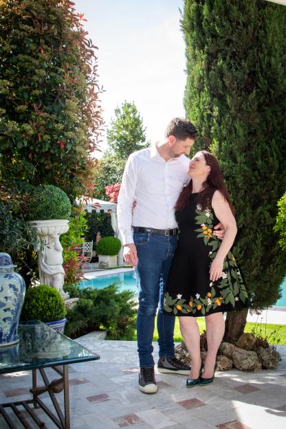 Couple embracing in a garden.