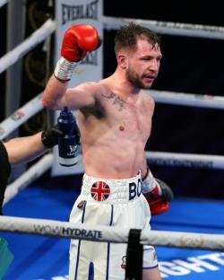 Boxer raising his arm in victory.