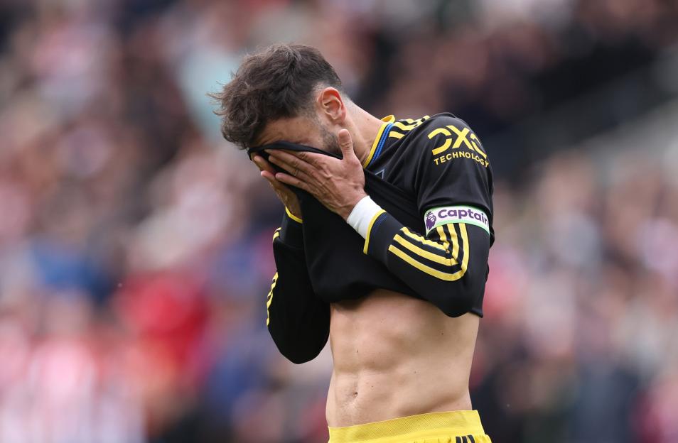 Manchester United's Bruno Fernandes reacting after his penalty shot was saved.