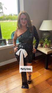 Woman in a sequined black dress.