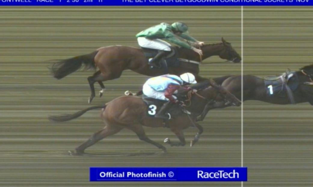 Official photofinish of a horse race, with three horses crossing the finish line, number 1 and 3 in the foreground.