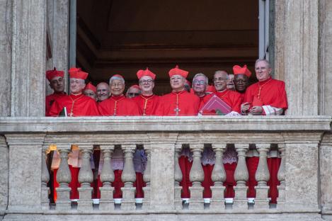 Cardinals on a balcony awaiting the announcement of the new Pope.