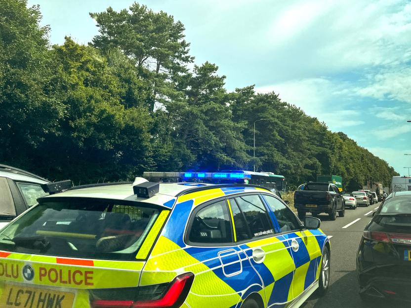 Police car driving on highway.
