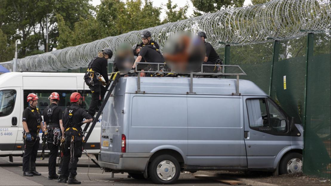 Three women charged over ‘TERROR offence’ after van ‘rams into defence firm factory fence’ as cops seek to trace car