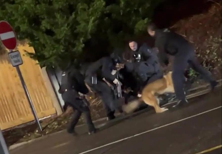 Police officer shouting for cuffs