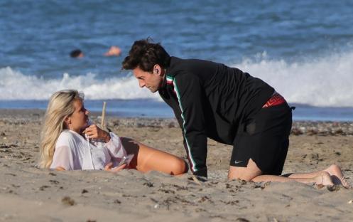 James Argent and Nicoline Artursson on a beach in Spain.