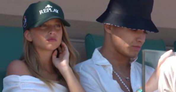 Lando Norris and Margarida Corceiro at a tennis match.