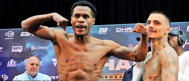 Two shirtless boxers at a weigh-in.