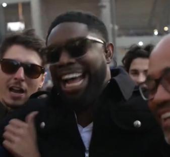 Micah Richards with fans in Paris before a match.