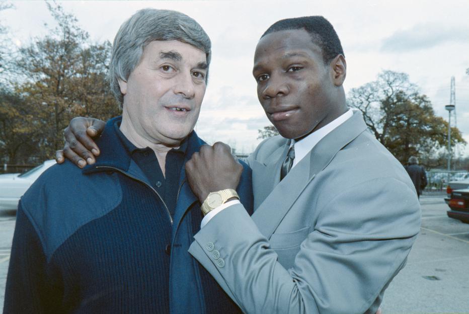 Chris Eubank with a boxing journalist the day after a fight with Nigel Benn.