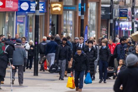 Shoppers on a busy high street.