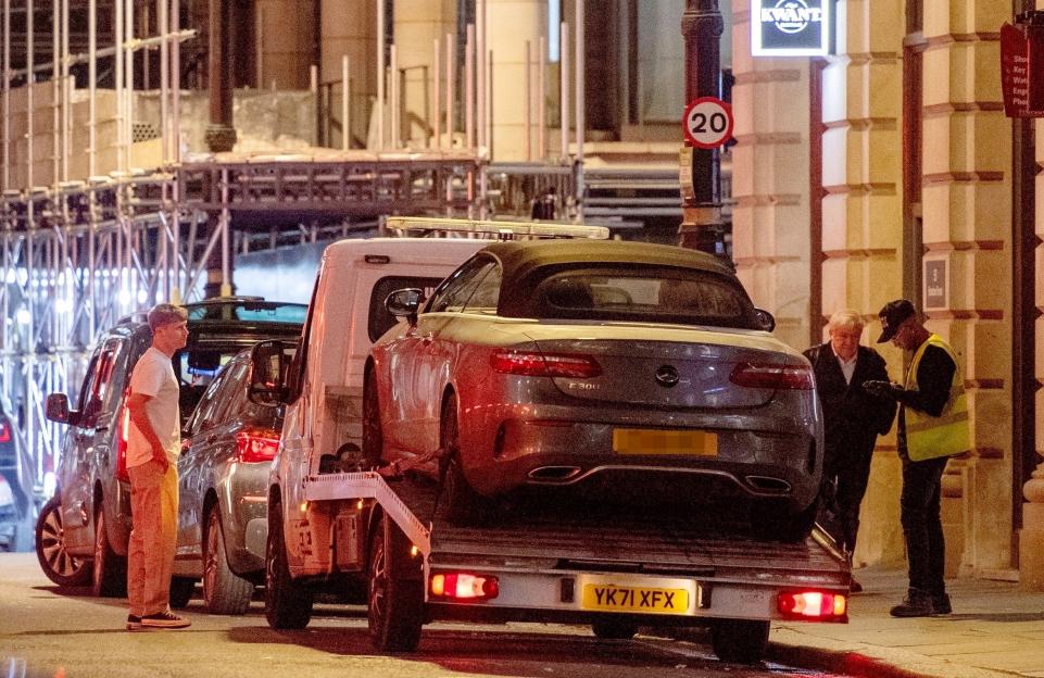 Jamie Borthwick's Mercedes convertible being loaded onto a tow truck.