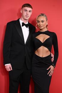 Couple in formal wear at an event.