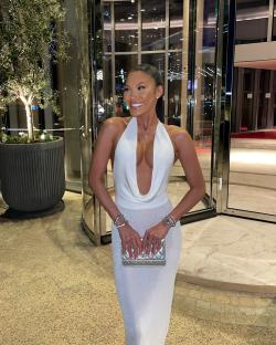Sophie Lee, motivational speaker, in a white dress.