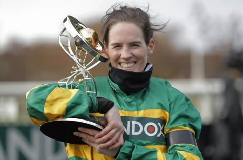 Rachael Blackmore celebrates with the trophy after victory on Minella Times in the Grand National on day three of the Aintree Grand National racing festival 2021 at Aintree Racecourse on April 10th 2021 in Liverpool (Photo by Tom Jenkins/Getty Images)