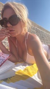 Megan Barton Hanson shows off her very shapely bum as she sunbathes in UK heatwave