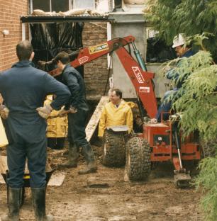 Police excavating a garden.