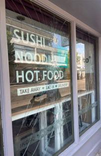 Shattered window of Kokoro restaurant.