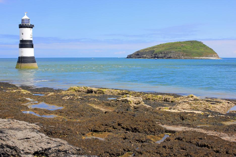 Penmon Point Lighthouse and Puffin Island, Anglesey, Wales.