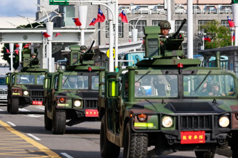 Military vehicles in a motorcade.