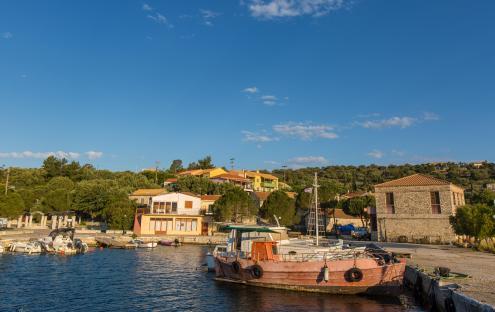 Kastos Island harbor in the Ionian Sea with boats and buildings.