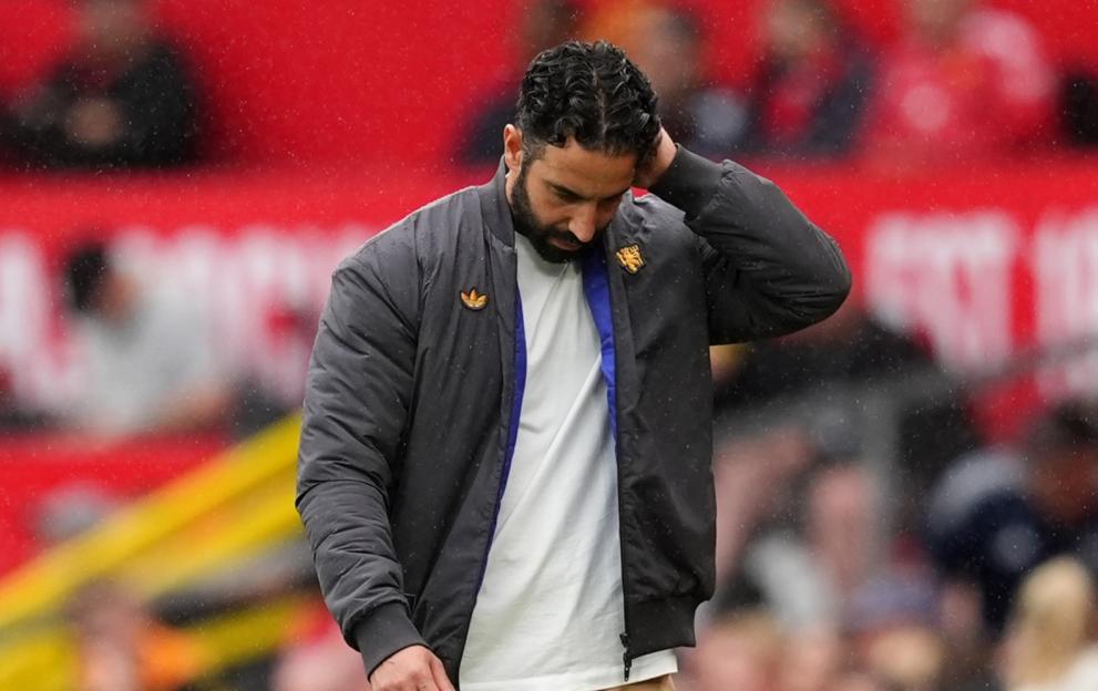 Ruben Amorim, Manchester United manager, walking on the pitch.
