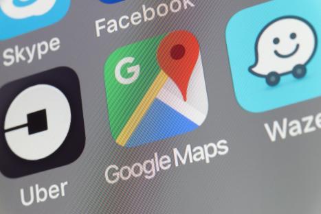 Smartphone screen displaying Google Maps, Waze, and Uber app icons.