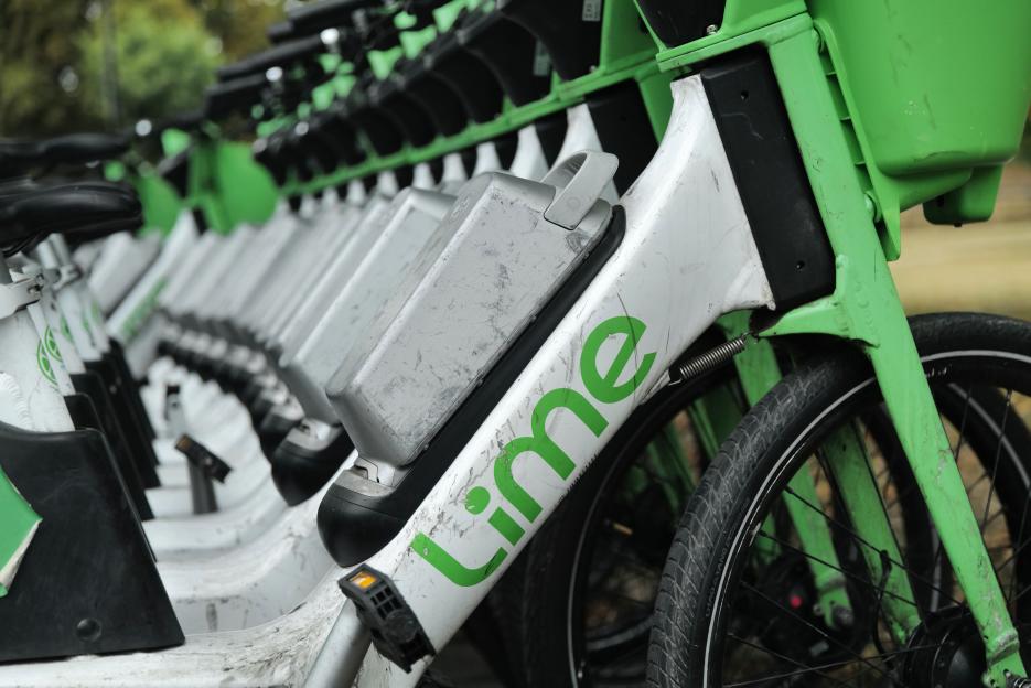 Lime bikes parked in a row.