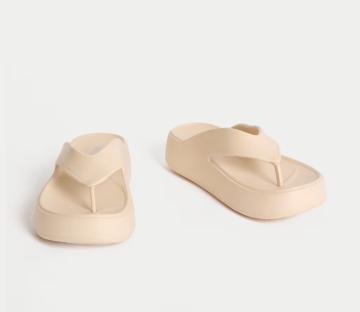 Beige platform flip-flops.