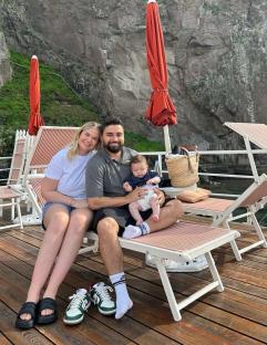 Couple on vacation with their baby.