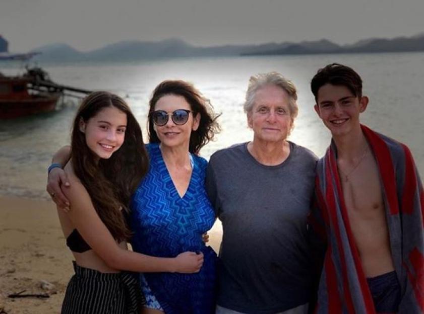 Catherine Zeta-Jones, Michael Douglas, and their children on a beach vacation.