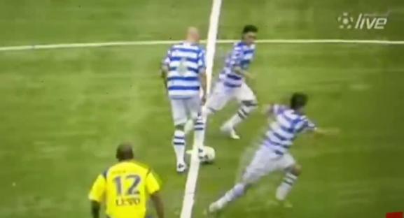 Soccer players during a kickoff.