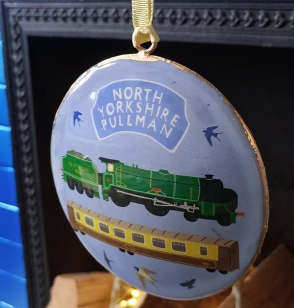 North Yorkshire Pullman Christmas ornament with an illustration of a green train and yellow carriage.