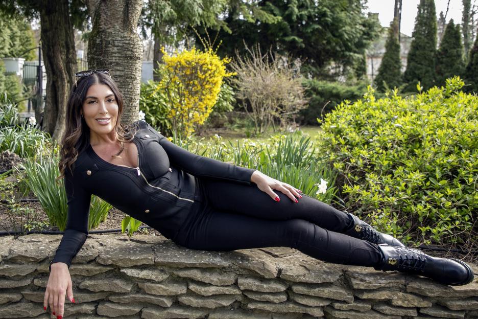 Ava Koxxx, Britain's tallest porn star, posing outdoors.