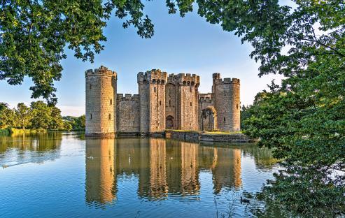 Bodiam Castle reflected in a moat.