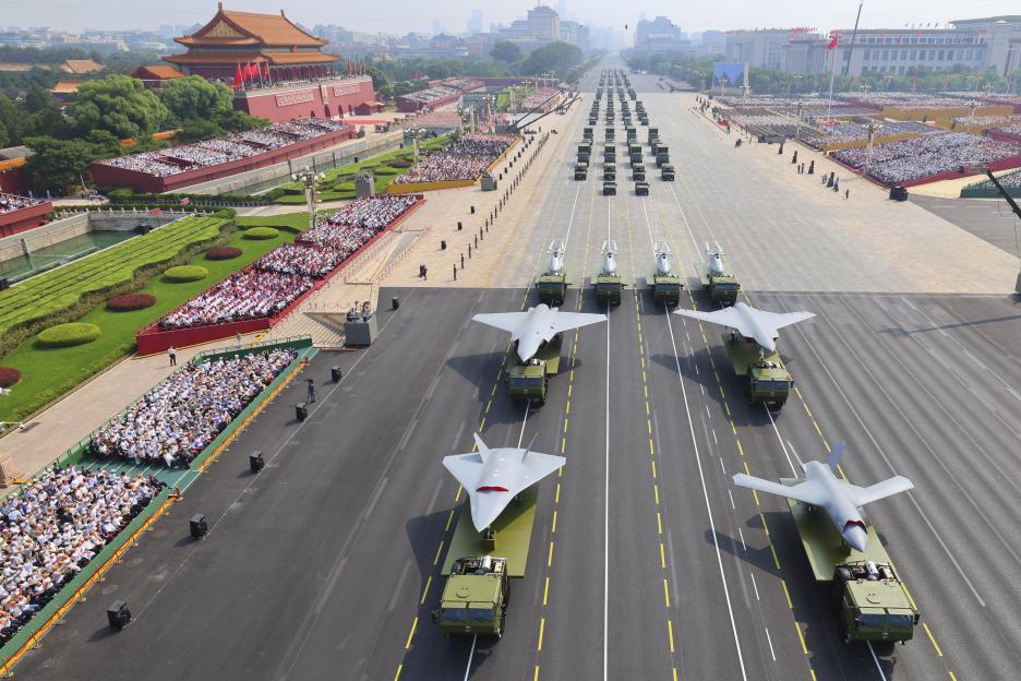 Military parade in Beijing with drones and other weaponry.