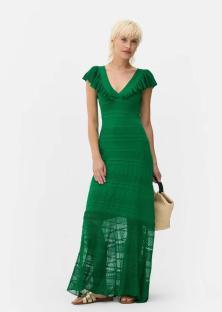Woman in a green knit maxi dress.