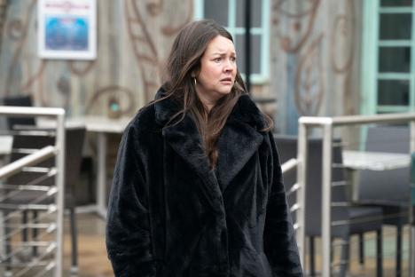 Stacey Slater from EastEnders in a black coat.