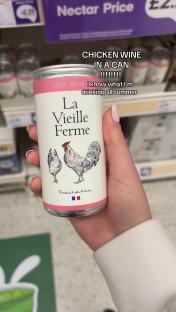 Hand holding a can of La Vieille Ferme rosÃ© wine.