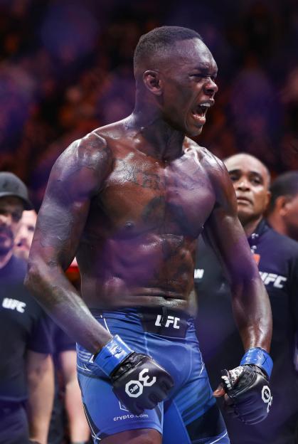 Israel Adesanya celebrating a victory.