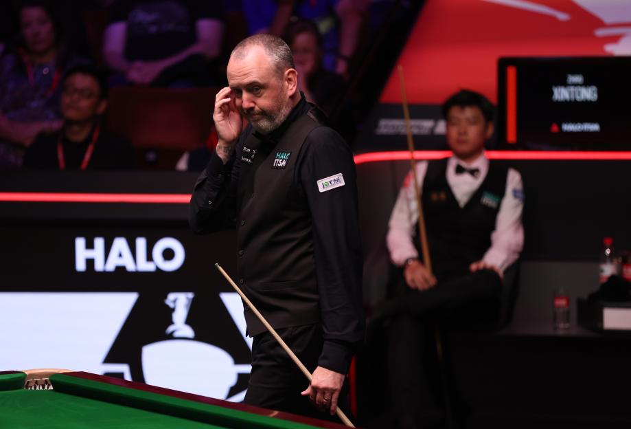 Mark Williams of Wales reacts during a snooker match.