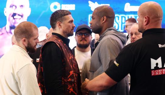 Oleksandr Usyk and Daniel Dubois facing off at a press conference.